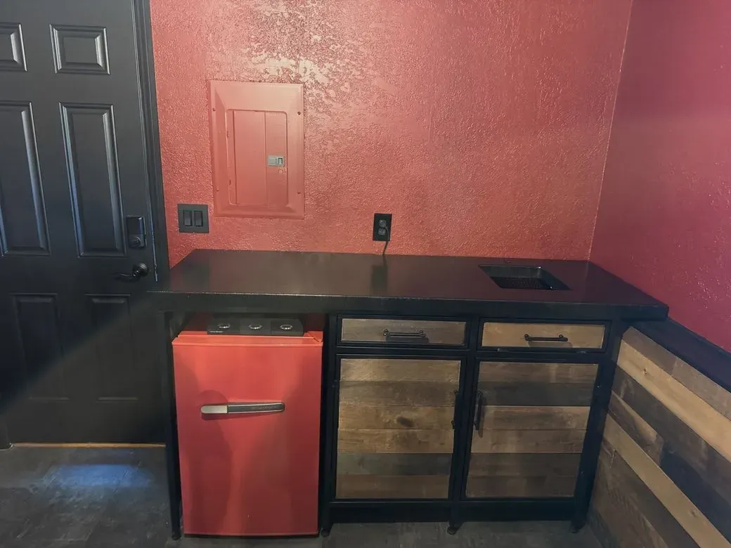 Custom desk and storage built into a red room