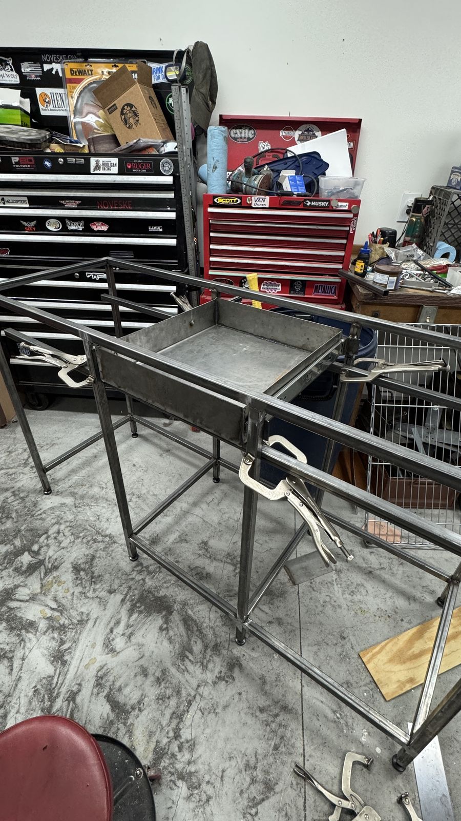 Welding the first base section in the shop.